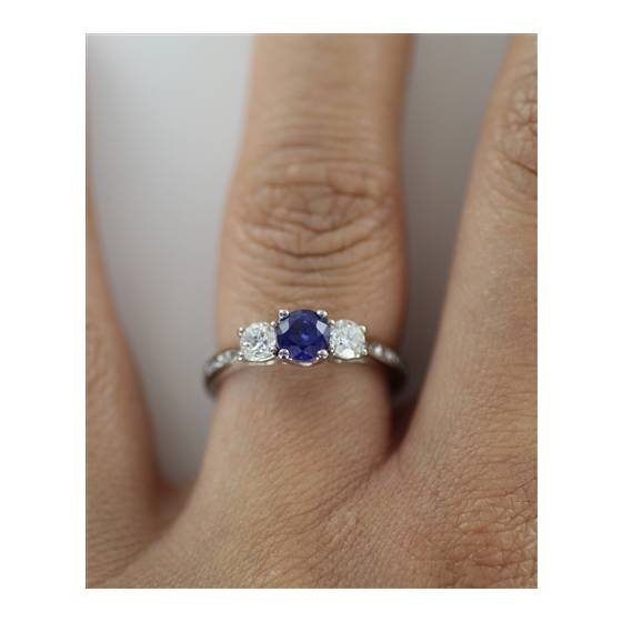 Modern Round Diamond and Blue Sapphire Trilogy Ring