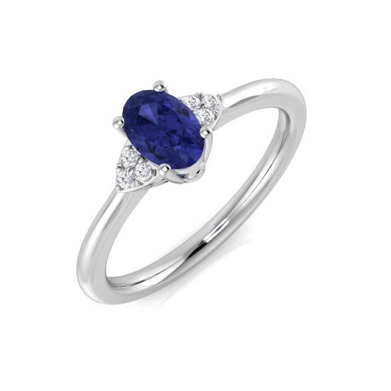 0.55ct VS/E-F Oval Tanzanite and Round Diamond Trilogy Ring