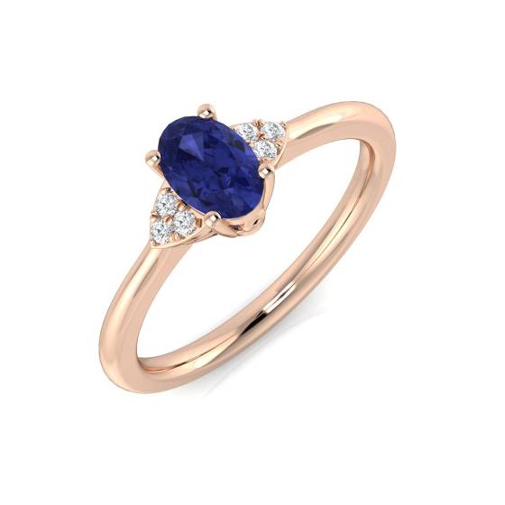 0.55ct VS/E-F Oval Tanzanite and Round Diamond Trilogy Ring