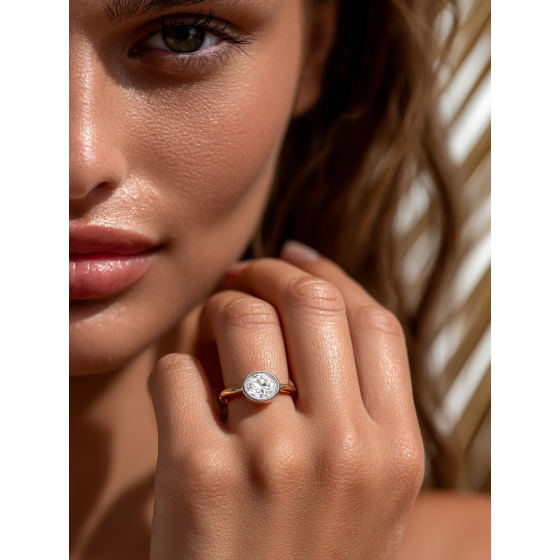 Oval Diamond Bezel Set East To West Solitaire Ring